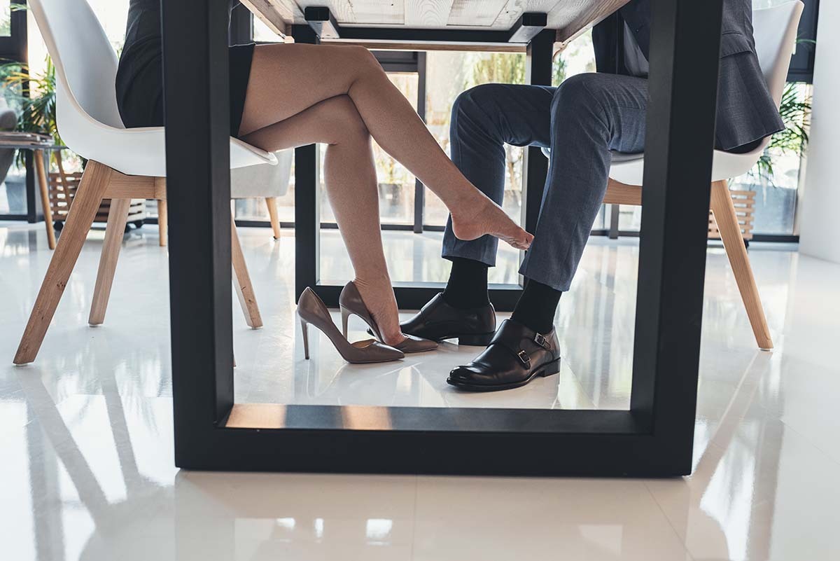 Woman Plays Footsie Under the Table - Body Language