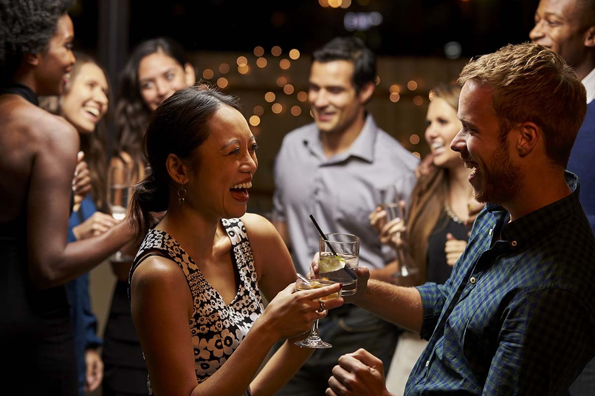 Group of People Engaged in Lively Conversation at a Party