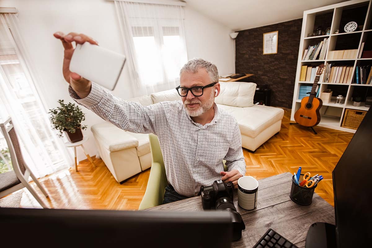 Older Man Takes Selfie for His Profile Pictures