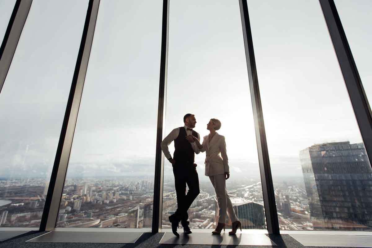 Couple Looks Out Over City - Make Time For a Relationship