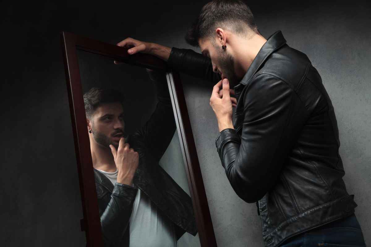 Man looking at himself in a mirror