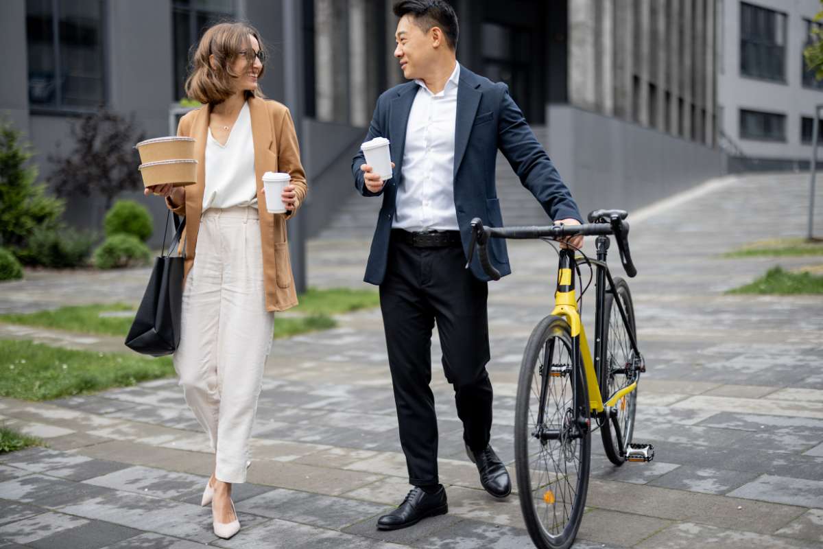 Professional couple walking together after work