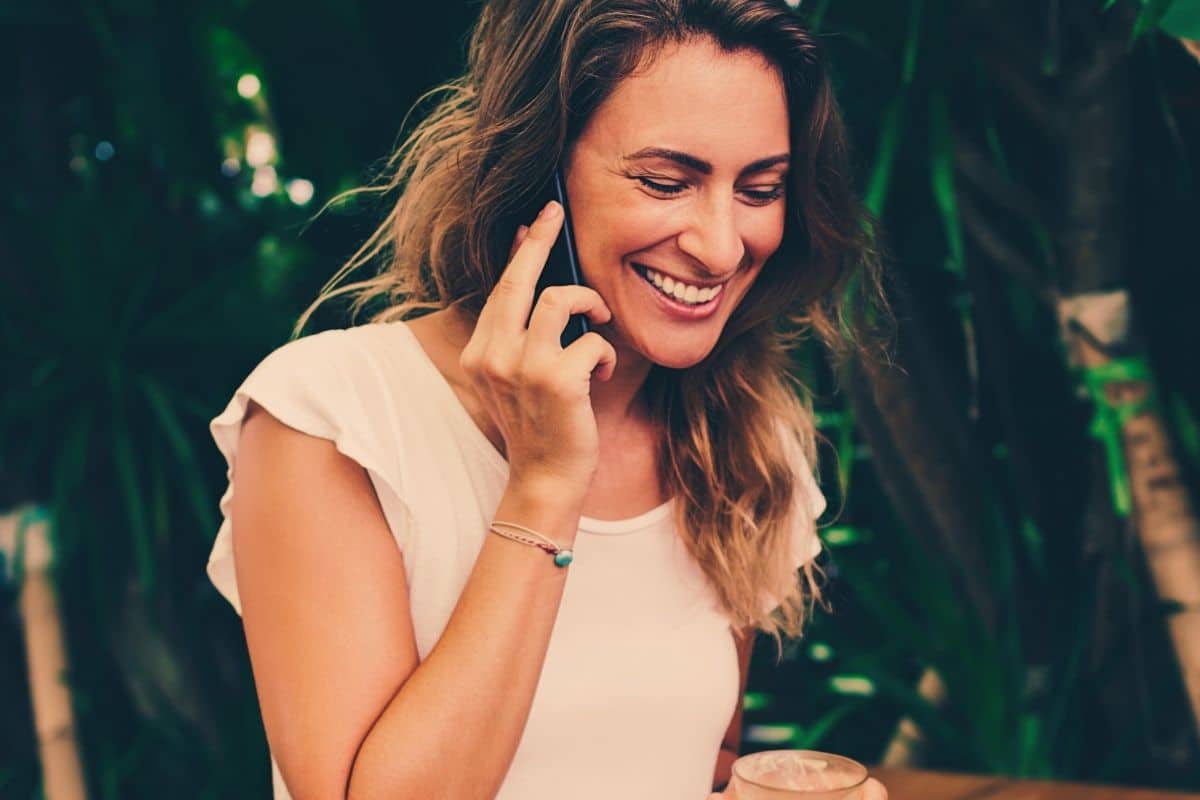 mature woman talking on the phone smiling