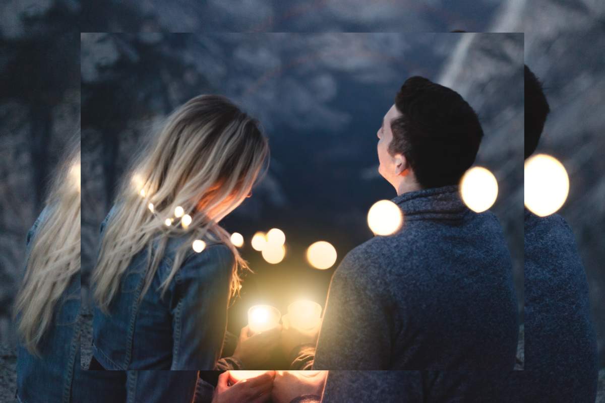 a man and woman on a date. he is talking about his career in an interesting and engaging way.